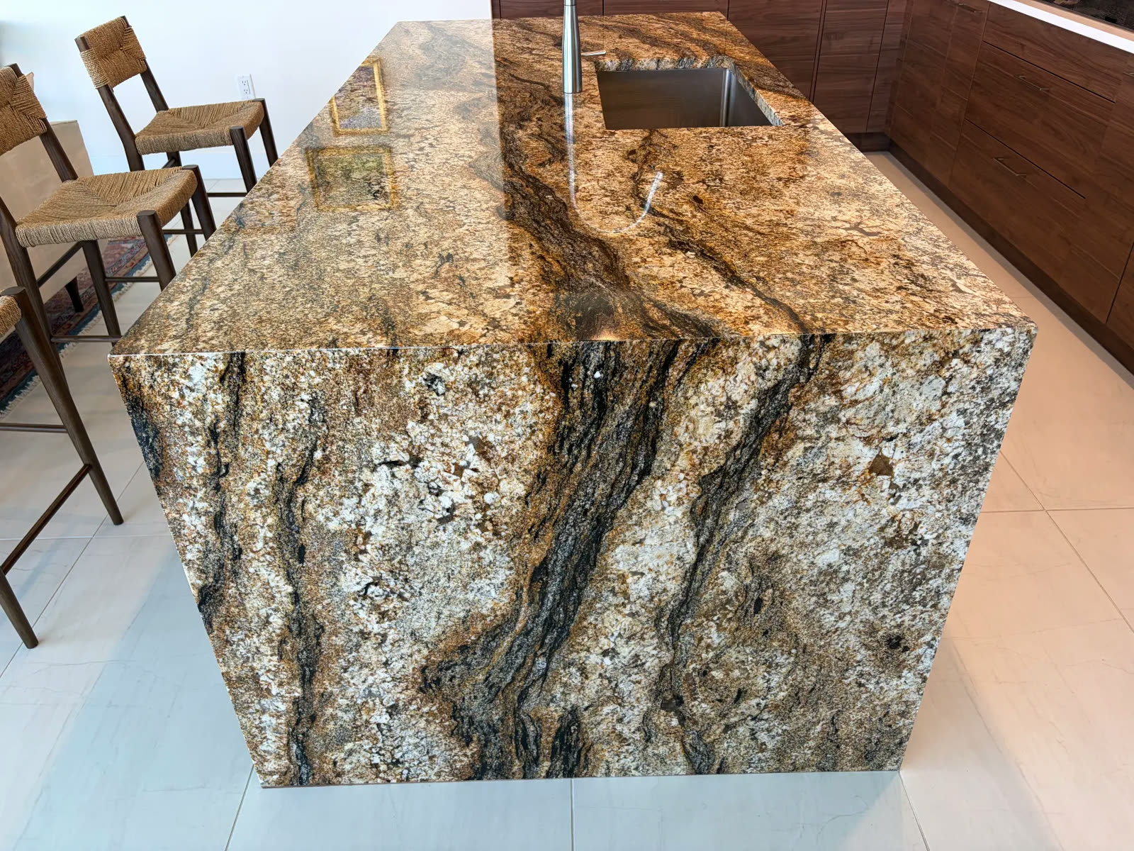 Waterfall-edge granite island seam repair by Luis's Home Repairs